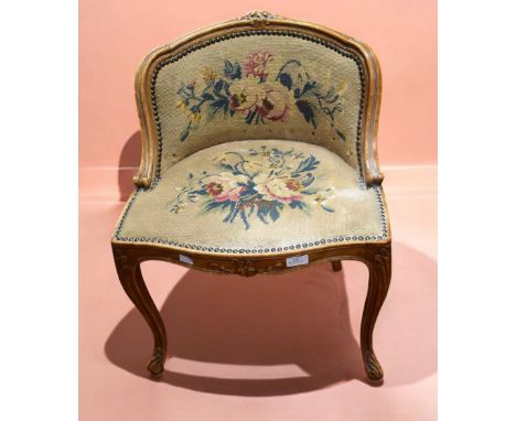 A Louis XV style mahogany framed music chair with tapestry rounded low back support, ornate carved detail, standing on elepha