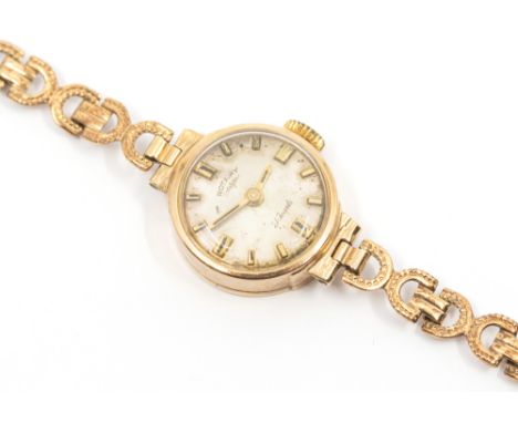 A ladies 9ct gold cased Rotary wristwatch, comprising a silvered round dial with applied baton markers, case approx 15mm, to 