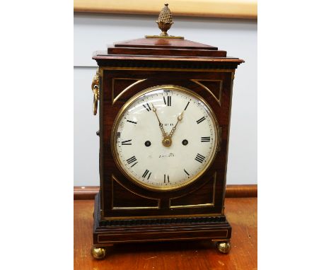 A 19th Century mantle clock by Alexander Purvis of London (Grosvenor Square) with rounded enamelled face, Roman numerals, 8 d