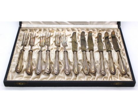 A pair of George III silver sugar tongs, London, 1806; a cased set of six Sheffield silver handled steel butter knives, toget