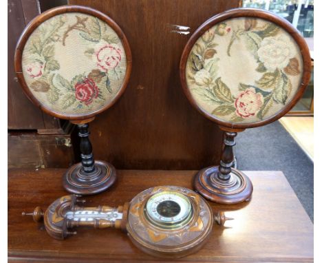 A pair of Victorian mahogany table screens with tapestry detail, on round stands and turned supports along with a Victorian m