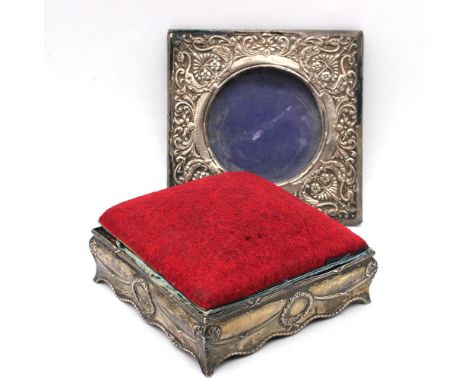 An Edwardian silver cased square shaped pin cushion trinket box, hinged cushion area opening tio reveal material interior, si