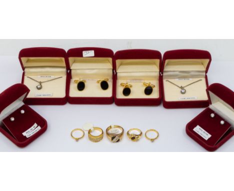 A collection of costume jewellery to include cz silver pendants and chains, along with yellow metal plated stone set rings,  
