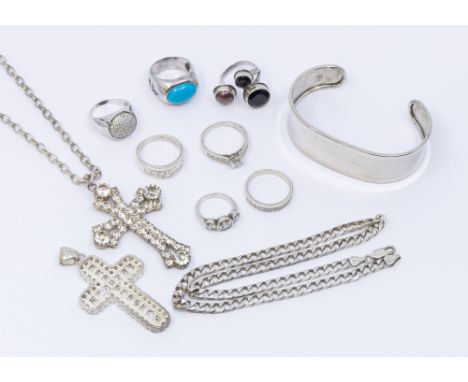 A small collection of silver jewellery to include paste set cross and curb link chain, along with stone set rings including t
