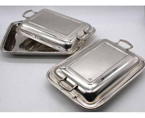A pair of 20th Century silver plated entree dishes and covers. (2)