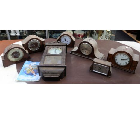 A collection of early to mid 20th Century mantle clocks along with an early 20th Century wall hanging 8 day clock.