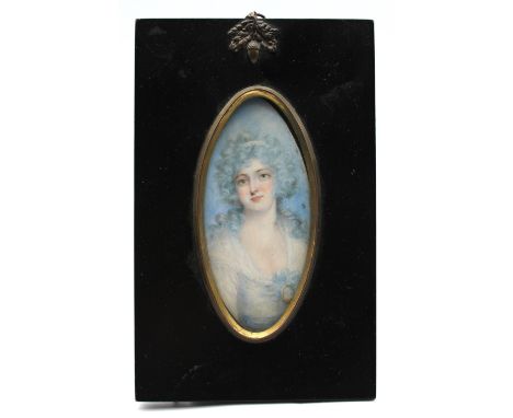 English School (18th Century) Portrait miniature of Mrs Crick powdered hair, her fichu tied with a miniature navette shaped, 