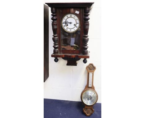 A late 19th/early 20th Century 8 day mahogany wall clock along with a mid to late 20th Century wall barometer.