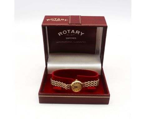 A ladies 9ct Rotary quartz wristwatch, comprising a round cream dial with applied baton markers, case approx 17mm, to a rope 
