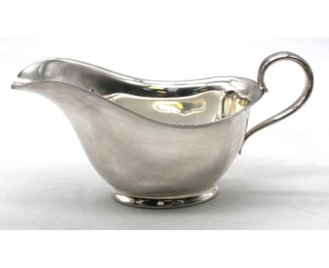 A George VI silver sauceboat, of plain stylish shape with scrolled handle, engraved K to side, hallmarked by Atkin Bros, Shef