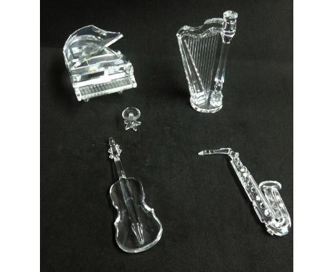 Swarovski, a collection of musical instruments including a harp, piano, saxophone and cello.