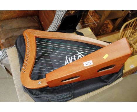 An Alclot harp with carry case