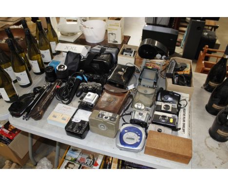A collection of vintage and other cameras, various accessories, game console controllers, VR headsets etc.
