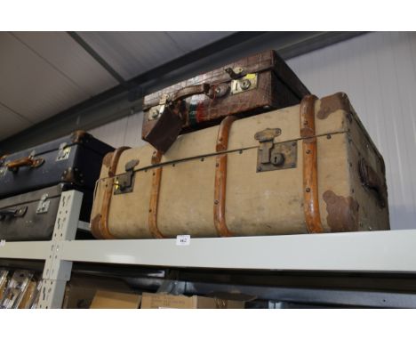 A vintage case and a wooden bound travelling trunk