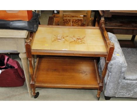 A teak and tile top tea trolley