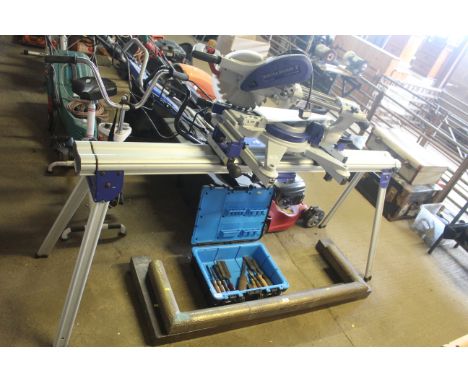 A Elektra Beckum KGS303 240V compound mitre saw with instruction guide fitted to Metabo KSU400 folding work bench
