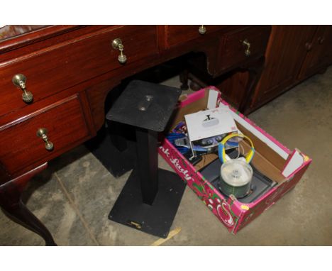 A box containing headphones, a Stealth VR headset etc and a pair of auto speaker stands