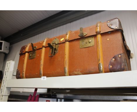 A vintage wooden bound travelling trunk