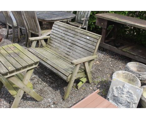 A wooden two seater garden bench 
