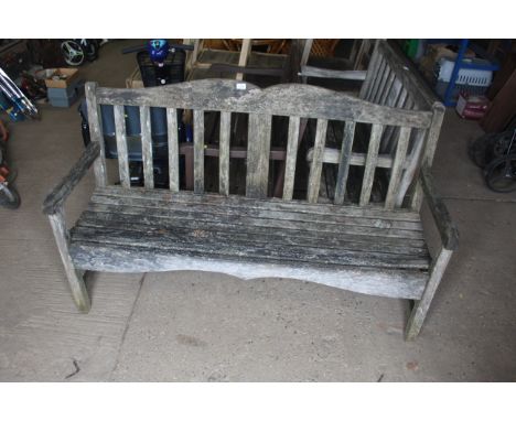 A garden hardwood three seater bench 