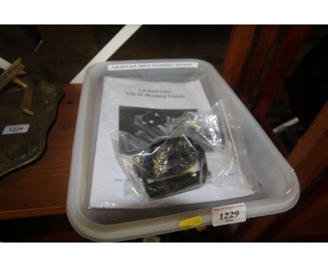 A Veritas MK2 honing guide with instruction manual used for sharpening edge cutting tools