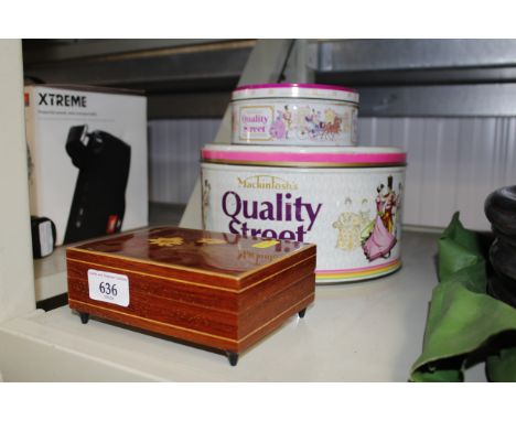 An inlaid musical trinket box and two Quality Street tins