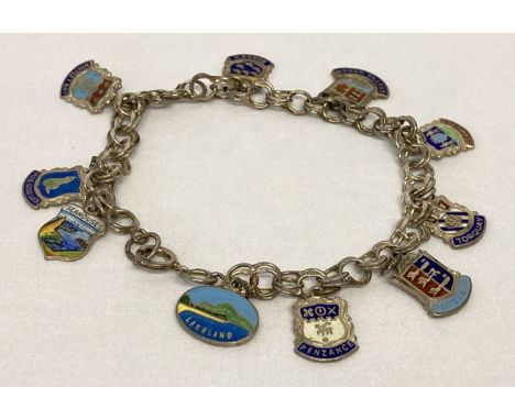 A vintage silver double belcher chain charm bracelet with 10 enamelled silver town &amp; county charms.   Total weight approx