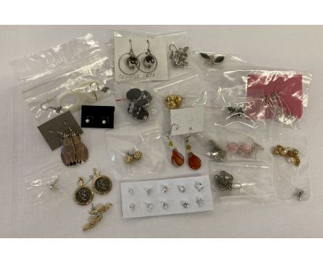 26 pairs of vintage and modern costume jewellery earrings in both drop and stud styles.  All for pierced ears. 