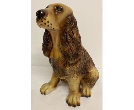 A large vintage plaster figure of a spaniel.  Approx. 38cm tall.