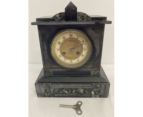 An antique slate and marble chiming mantel clock with gilt detailed face.  Complete with key and pendulum.  Approx. 28cm x 23