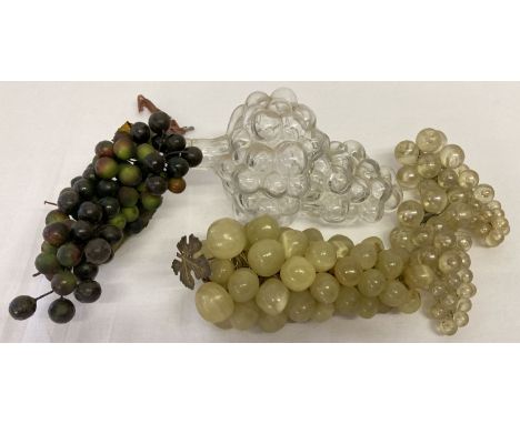 A vintage bunch of grapes made from onyx together with a bottle in the shape of a bunch of grapes. And 3 bunches of plastic g
