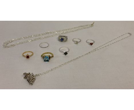 A collection of white metal and costume jewellery to include a vintage coach and coachmen pendant.  Also includes chains and 