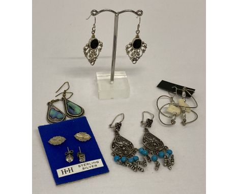 6 pairs of vintage and modern design silver and white metal earrings in both drop and stud styles.  To include onyx set openw