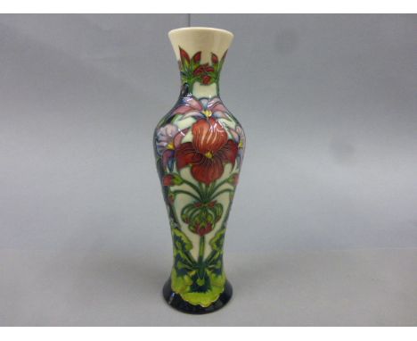 Moorcroft Pottery vase of slender baluster form designed by Philip Gibson with flowers and foliage, limited edition piece 14/