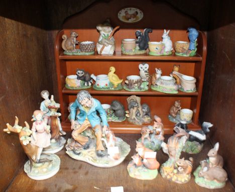 SECTION 20. Three Capodimonte porcelain figures, together with a small collection of Franklin Mint porcelain egg cups modelle