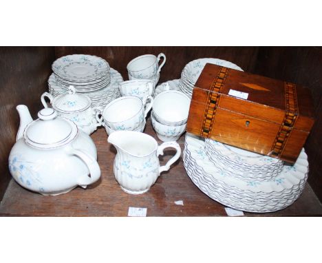 SECTION 7. A Myott white glazed porcelain dinner service and tea set, decorated with a blue floral design, together with a sm