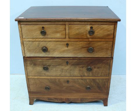 An early 20th century Walnut chest of two long drawers, the two deep drawers with ebony stringing and brass pulls simulating 