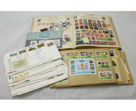 A small schoolboy collection of world stamps mounted in album. Part filled, some post marked, together with a small quantity 