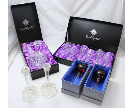 An Edinburgh cased set comprising cut glass decanter and six port glasses, together with two individually cased Bohemia red w