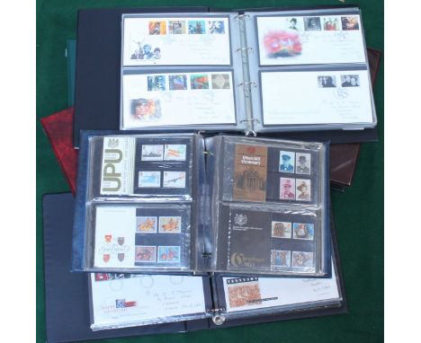 An album of fifty-four packs of ERII Decimal Royal Mail Mint Stamps, together with approximately 400 First Day Covers in five