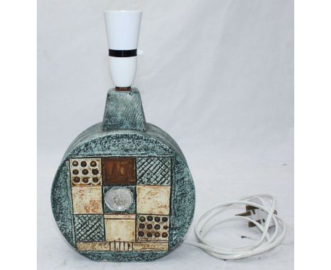 A Troika pottery 'wheel' shaped lamp, decorated with low relief moulded, geometric designs. 21cm high excluding light fitting