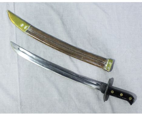 A WW2 sword with curved blade, black lacquered grip with brass detailing and brown leather scabbard. Possibly Malaysian or fa