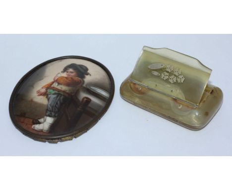 A 19th century painted porcelain oval portrait plaque of a young boy, approximately 9cm long, together with a horn snuff box 
