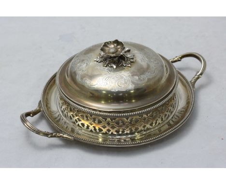 A Victorian silver butter dish by Henry Wilkinson & Co. the cover with floral carved decoration, enclosing clear glass liner 