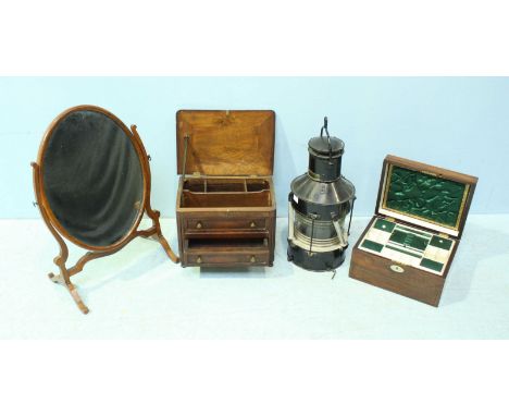 A black ships lamp by 'Alderson & Gyde' and a swinging oval toilet mirror, together with an ornate wooden trinket box and a w