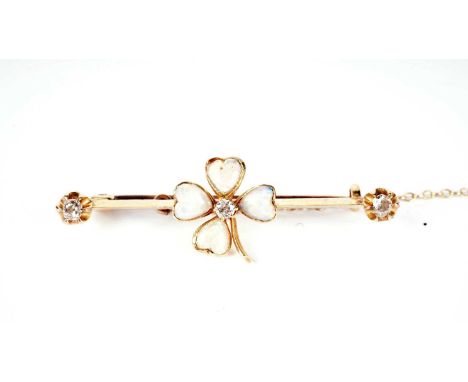 A late Victorian shamrock pattern bar brooch, set with four heart-shaped opal cabochons to leaves around an old-cut diamond f