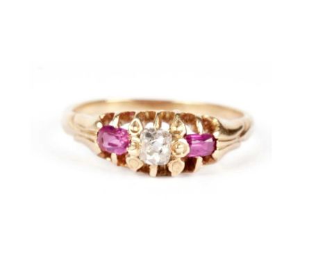 A ruby and diamond dress ring, having a central cushion-cut diamond flanked by two mixed-cut rubies, in an open claw setting,