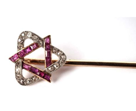 A Victorian ruby and diamond stick pin, the terminal in the form of interlocking triangles, set with calibré cut rubies and b