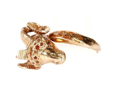 An 18ct yellow gold ram pattern ring, with orange-enamel decoration, ring size variable, 9.0g gross.