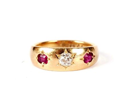 A Victorian ruby and diamond ring, the central old-cut diamond weighing approximately 0.20 carats in star-setting flanked by 